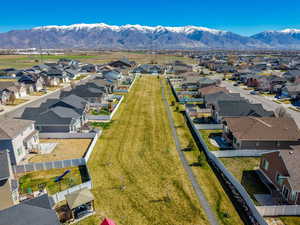 Aerial perspective of suburban area with a mountainous background