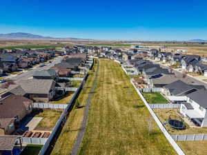 Aerial view of residential area featuring a mountainous background