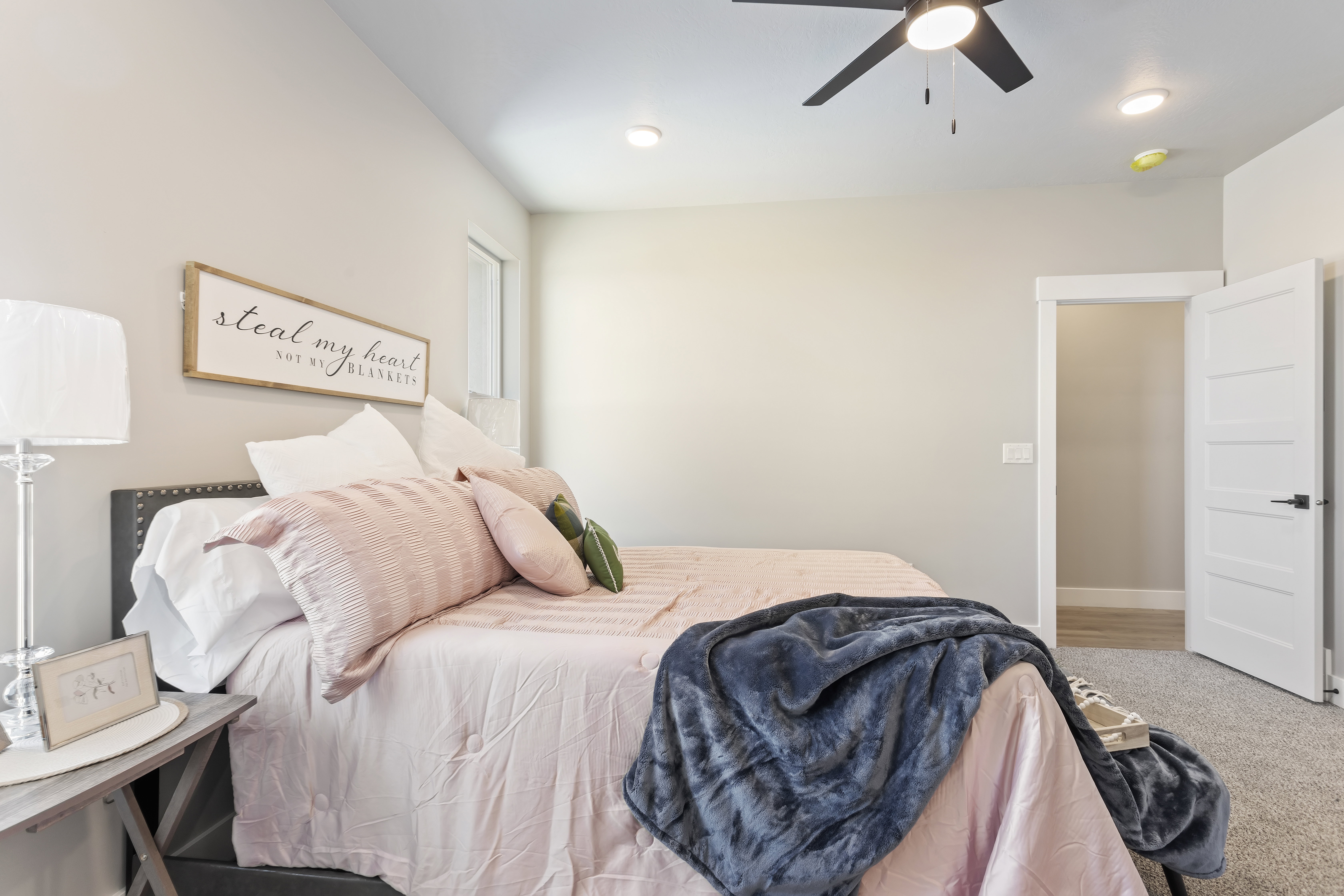 Bedroom featuring a ceiling fan, light colored carpet, and recessed lighting