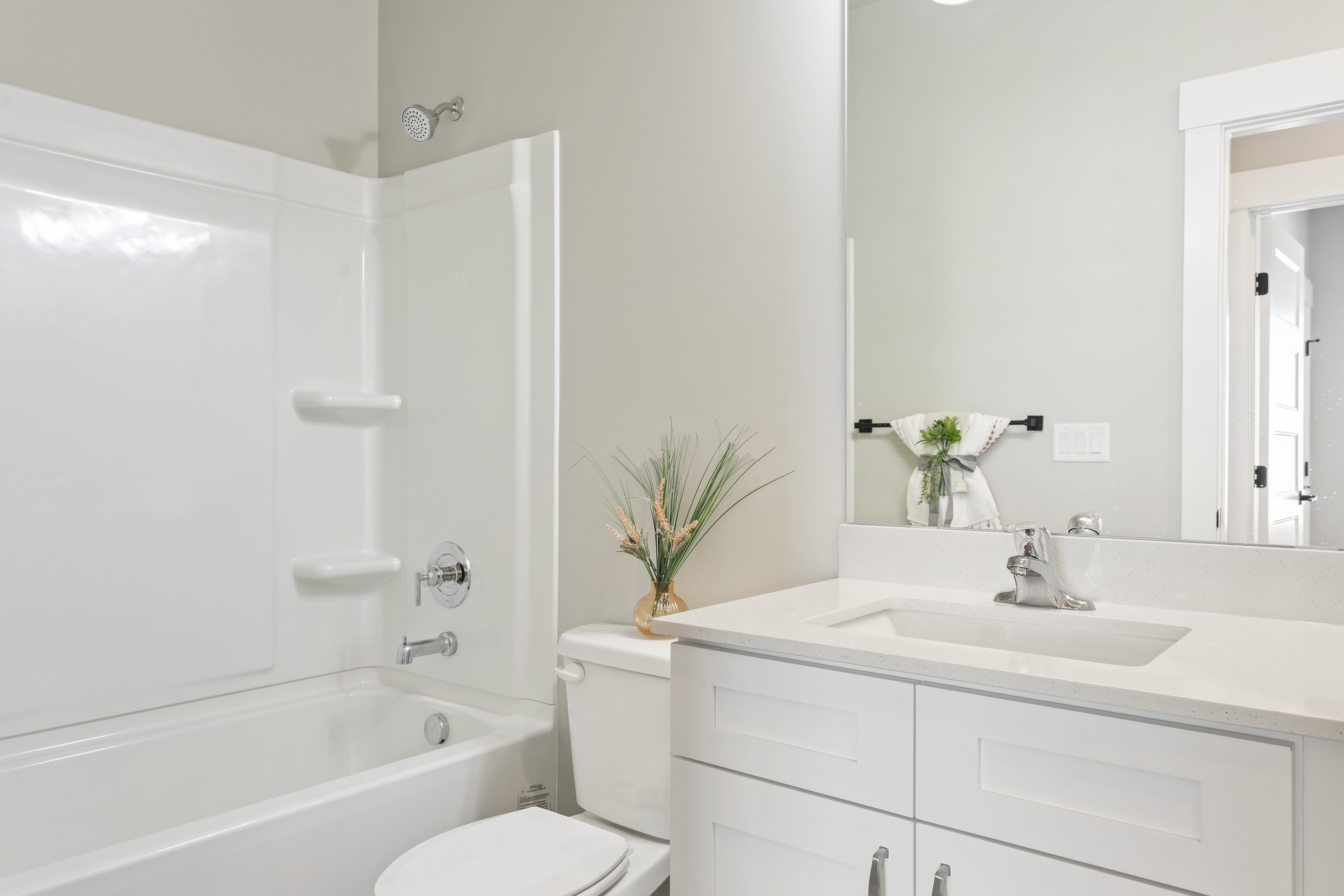 Bathroom with vanity and shower / washtub combination