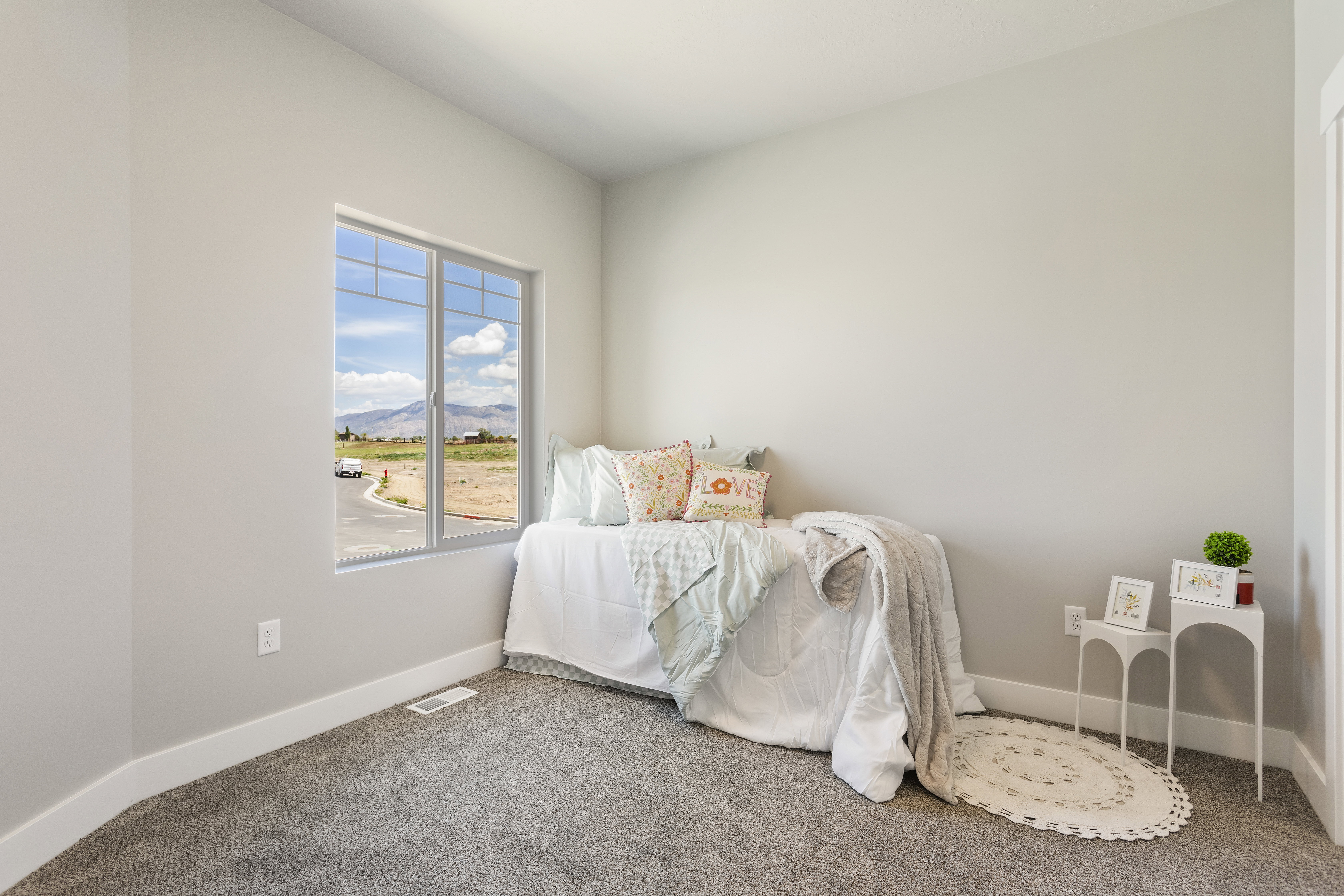 Bedroom featuring a mountain view and carpet floors