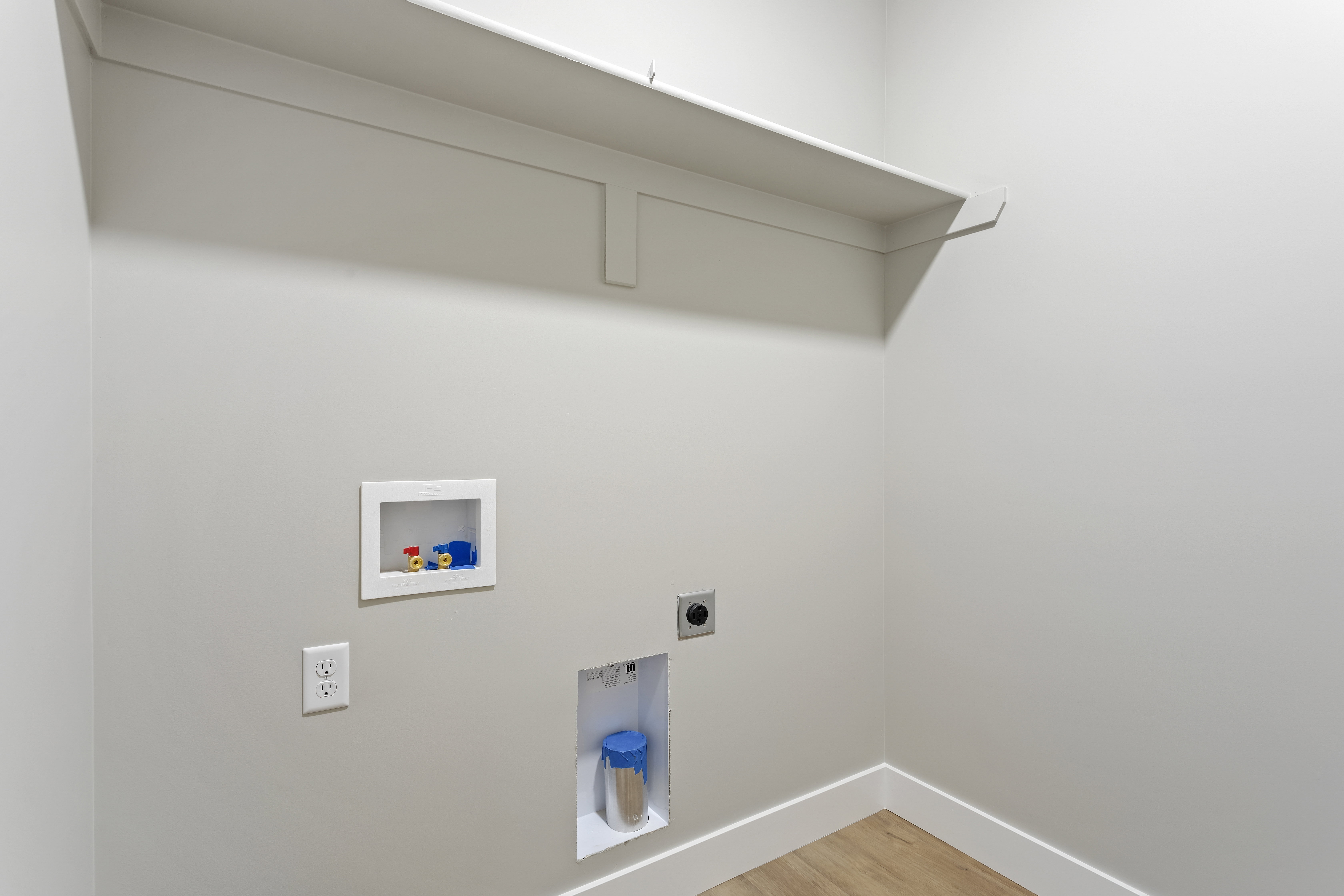 Laundry room with light wood-style floors, electric dryer hookup, and washer hookup
