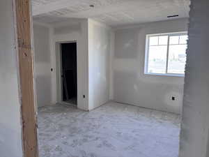 Spare room with a textured ceiling