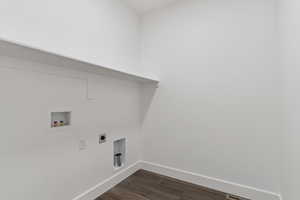 Laundry area featuring hookup for an electric dryer, dark wood-style flooring, and washer hookup