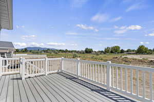 Wooden terrace featuring a mountain view