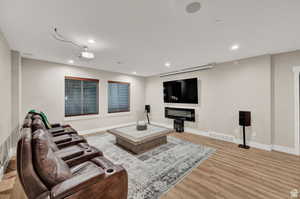 Living room featuring light wood-style floors and recessed lighting
