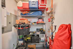 Storage room featuring electric panel