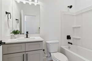 Bathroom with vanity and shower / bathtub combination