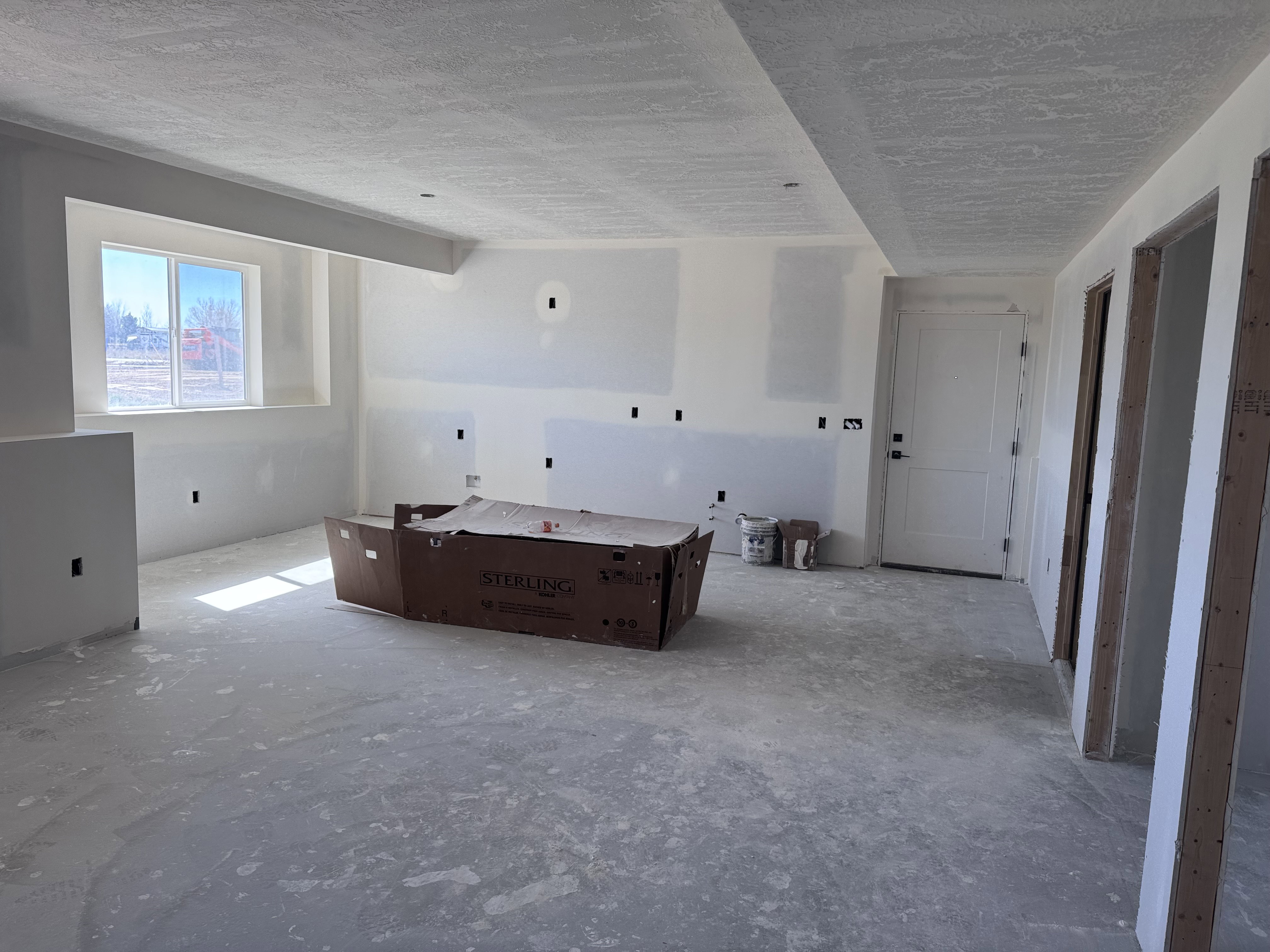 Interior space featuring a textured ceiling