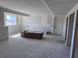 Interior space featuring a textured ceiling