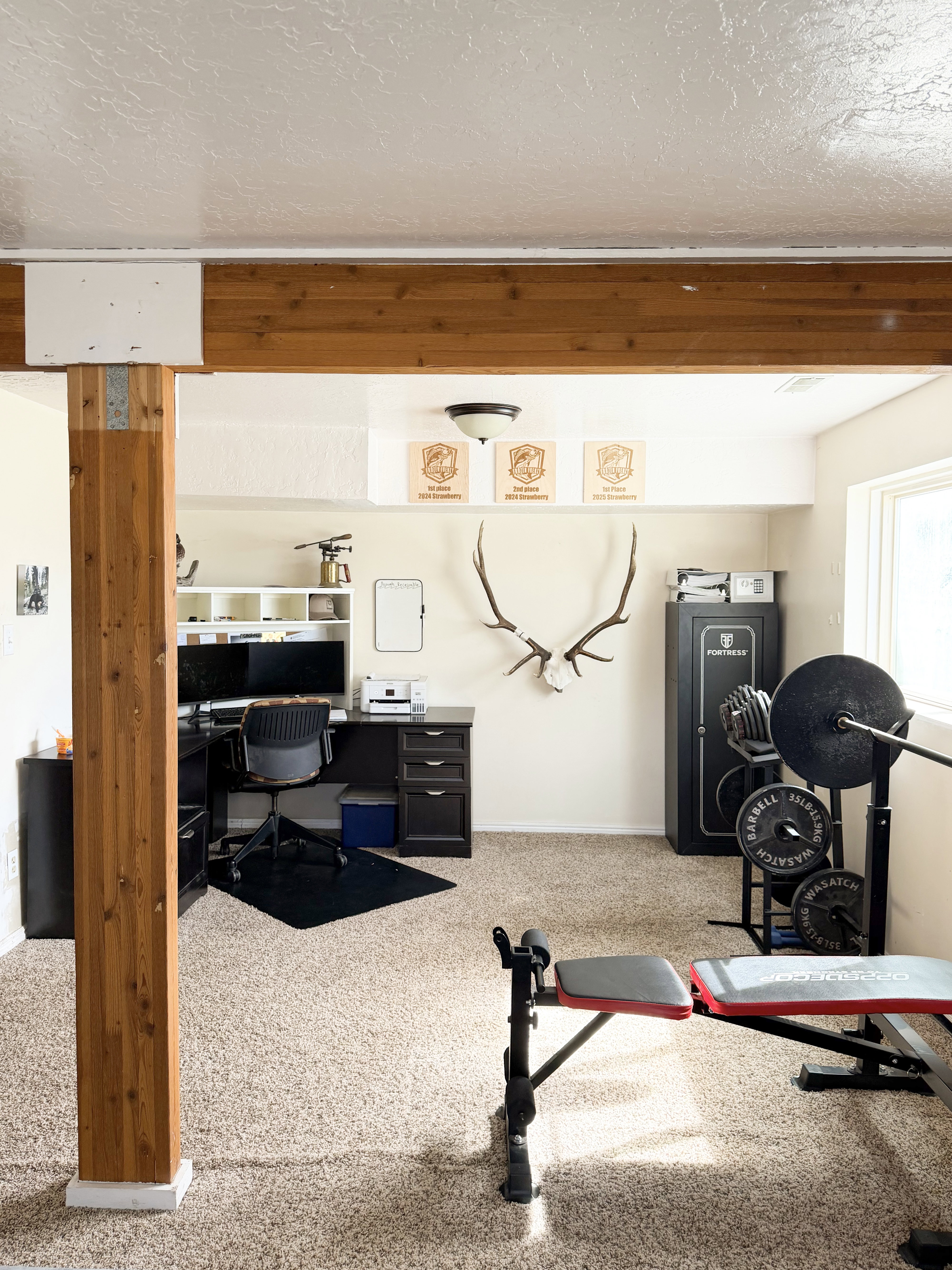 Workout area featuring a textured ceiling and carpet floors