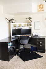Office area featuring light colored carpet and desk