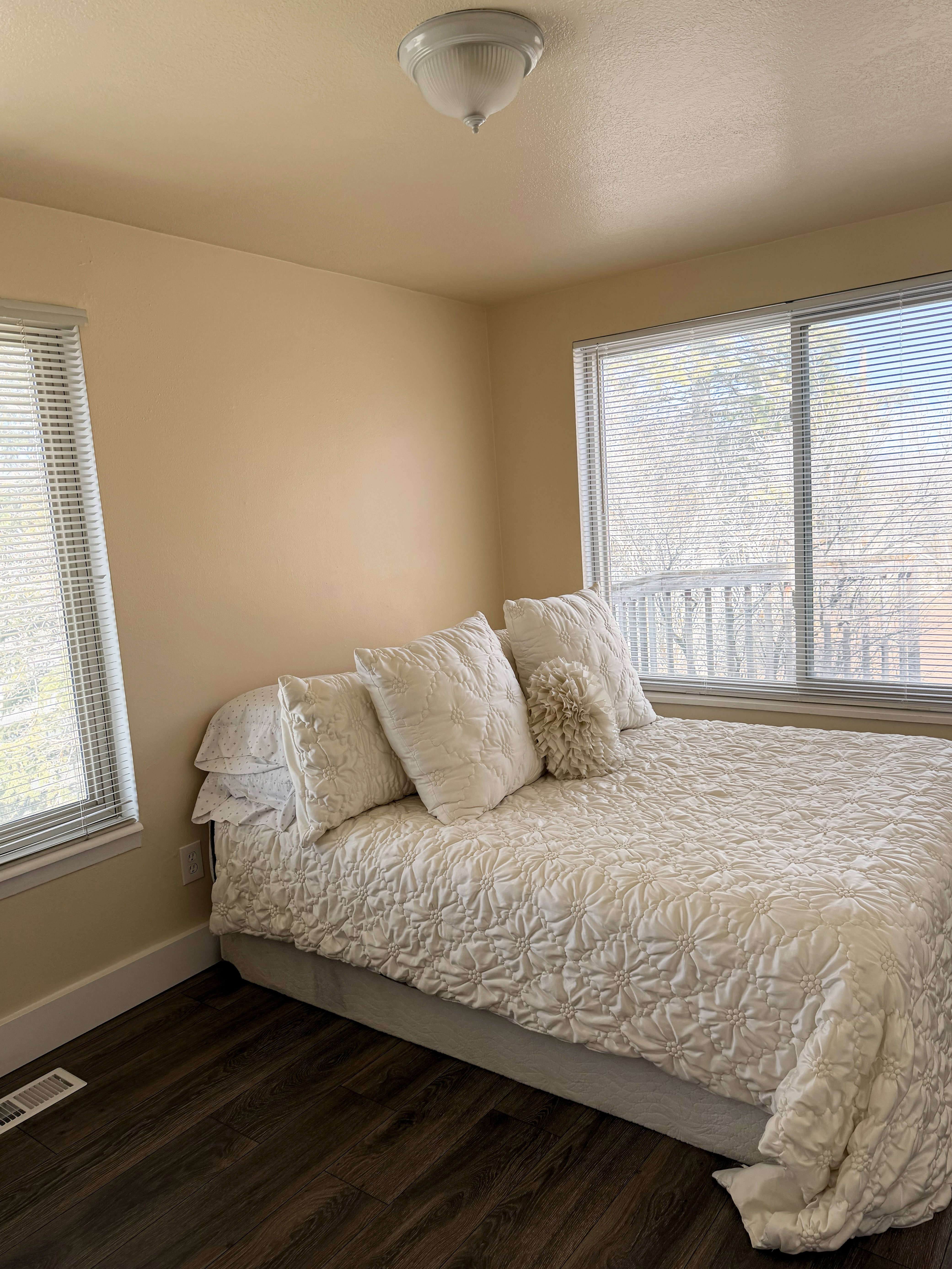 Bedroom featuring wood-style flooring and baseboards