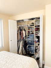Bedroom with a closet and wood finished floors