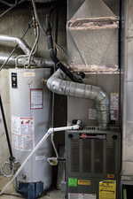 Utilities featuring gas water heater and heating unit