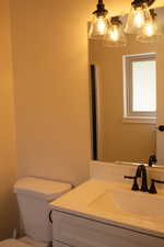 Master bathroom featuring toilet and vanity