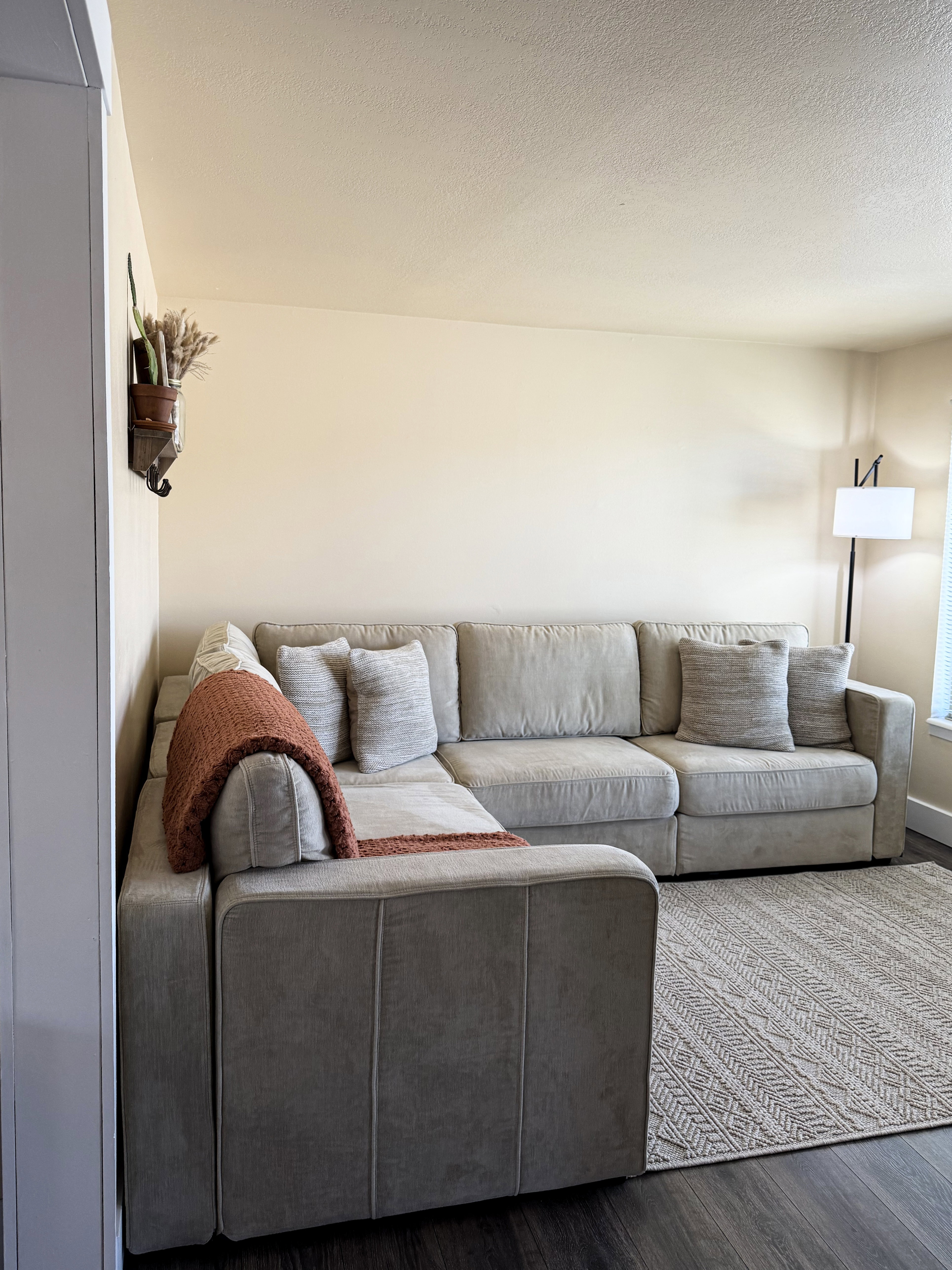 Living room featuring wood finished floors and a textured ceiling