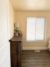 Detailed view of wood finished floors and a textured ceiling