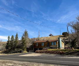 View of front of home featuring an attached garage and driveway