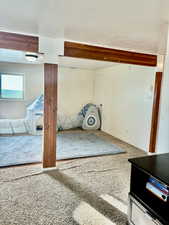 Unfurnished living room with carpet floors