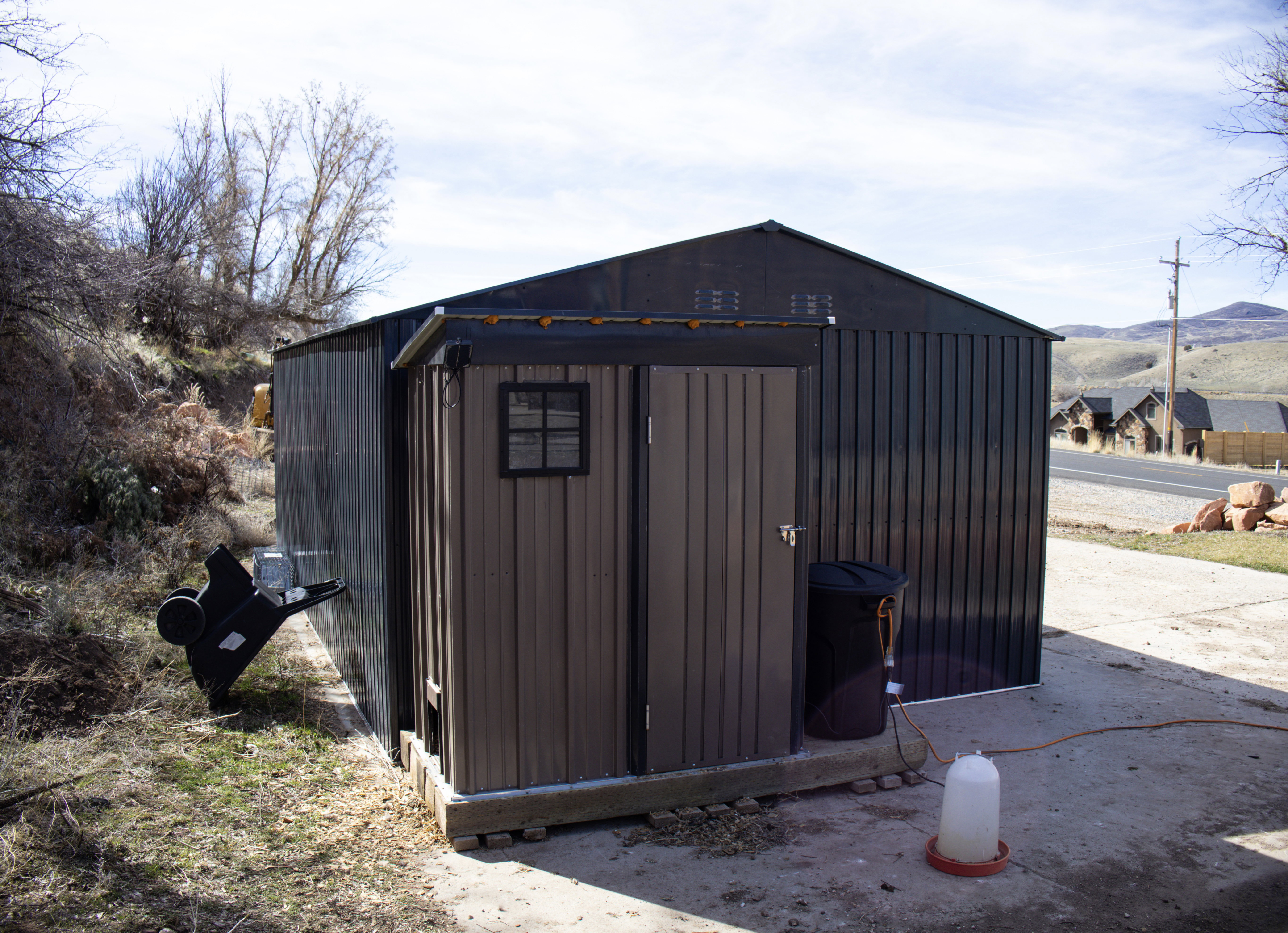 View of chicken coop with a mountain view