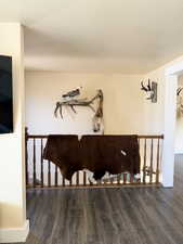 Detailed view of wood finished floors and a textured ceiling