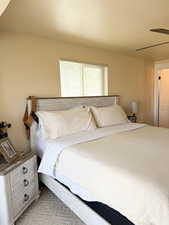 Master bedroom featuring a textured ceiling and a ceiling fan