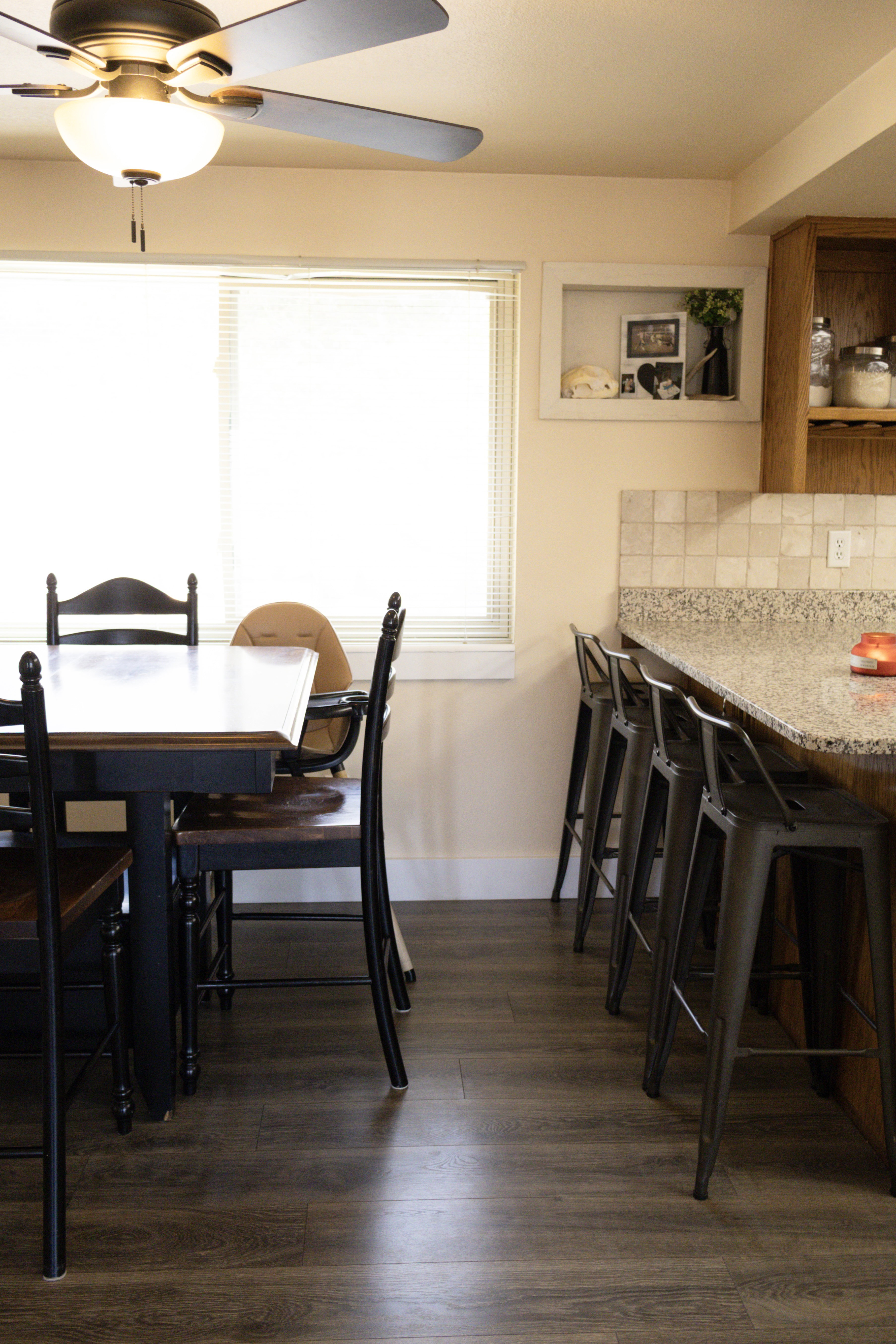 Dining space with wood-type flooring and ceiling fan