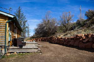 View of yard with a wooden deck