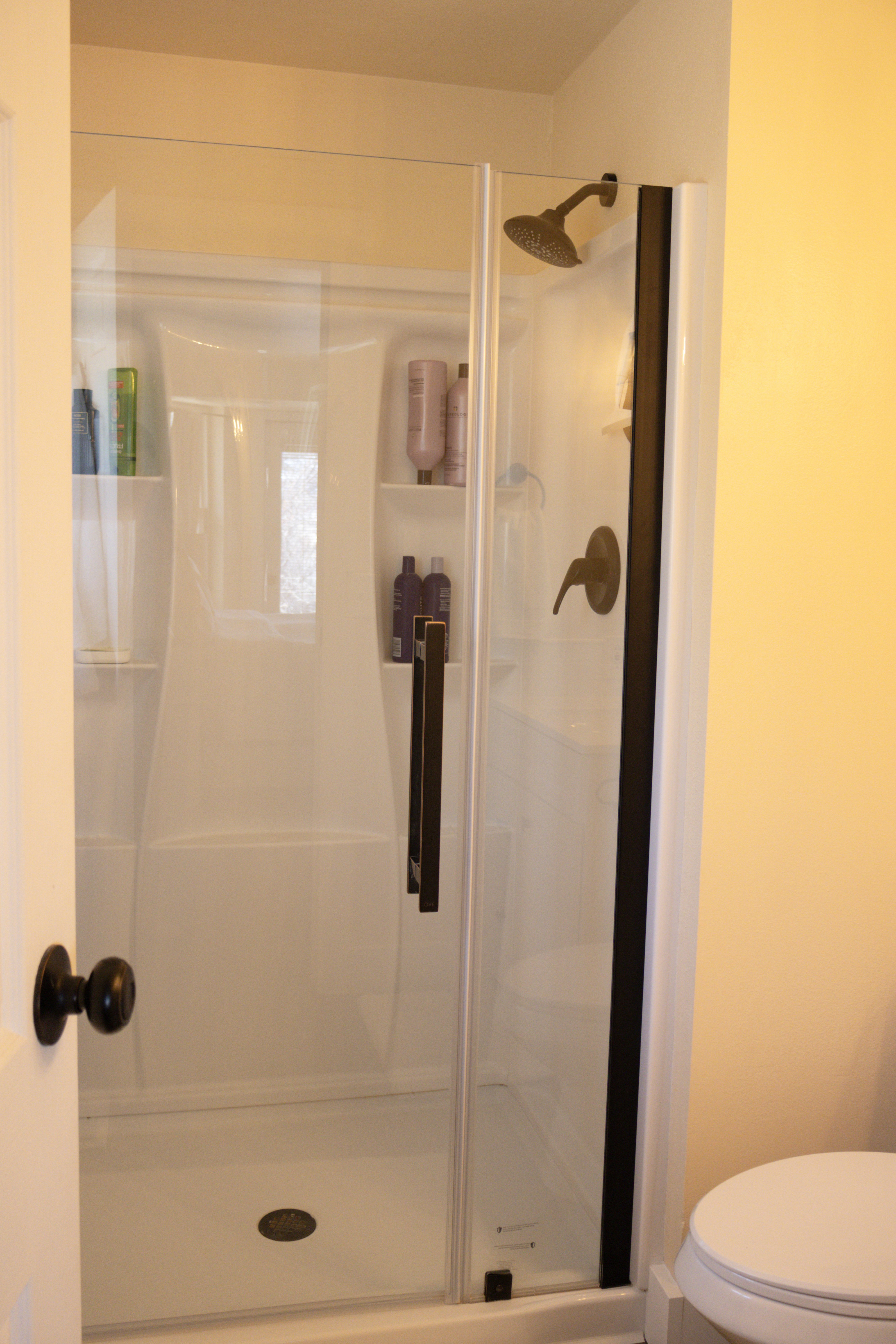 Full master bathroom with a stall shower
