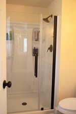 Full master bathroom with a stall shower