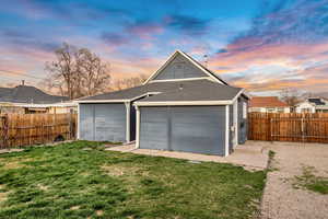 View of garage at dusk