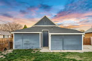 View of garage at dusk
