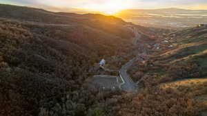 Aerial view at dusk of a mountain view and a wooded view