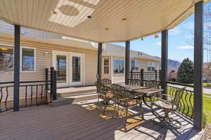 Wooden terrace with a mountain view and outdoor dining area