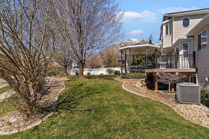 View of yard featuring a deck with mountain view