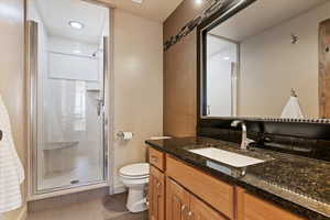 Bathroom with a shower stall and vanity