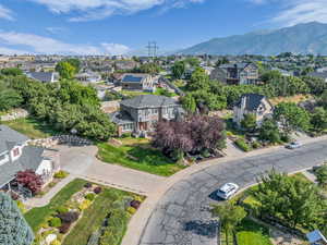 Aerial perspective of suburban area featuring a mountainous background