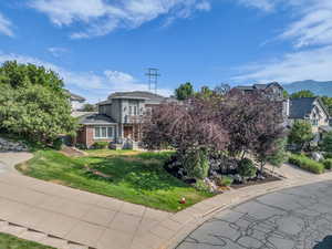View of front of property with a front lawn and brick siding