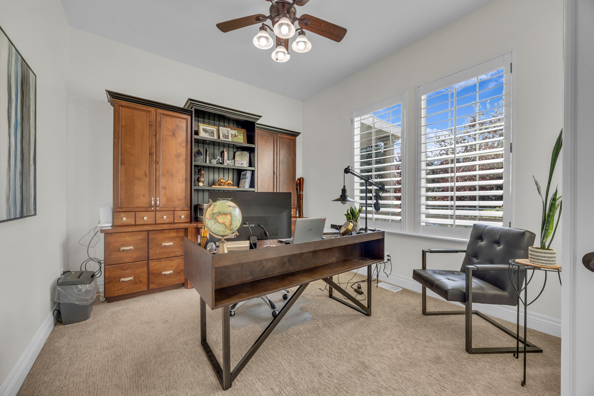 Office featuring ceiling fan and light carpet