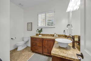 Bathroom featuring vanity and light tile patterned flooring