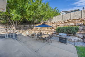 View of patio / terrace with area for grilling and outdoor dining area