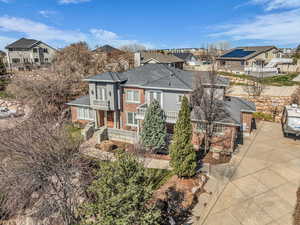 View of front of house featuring brick siding and a residential view