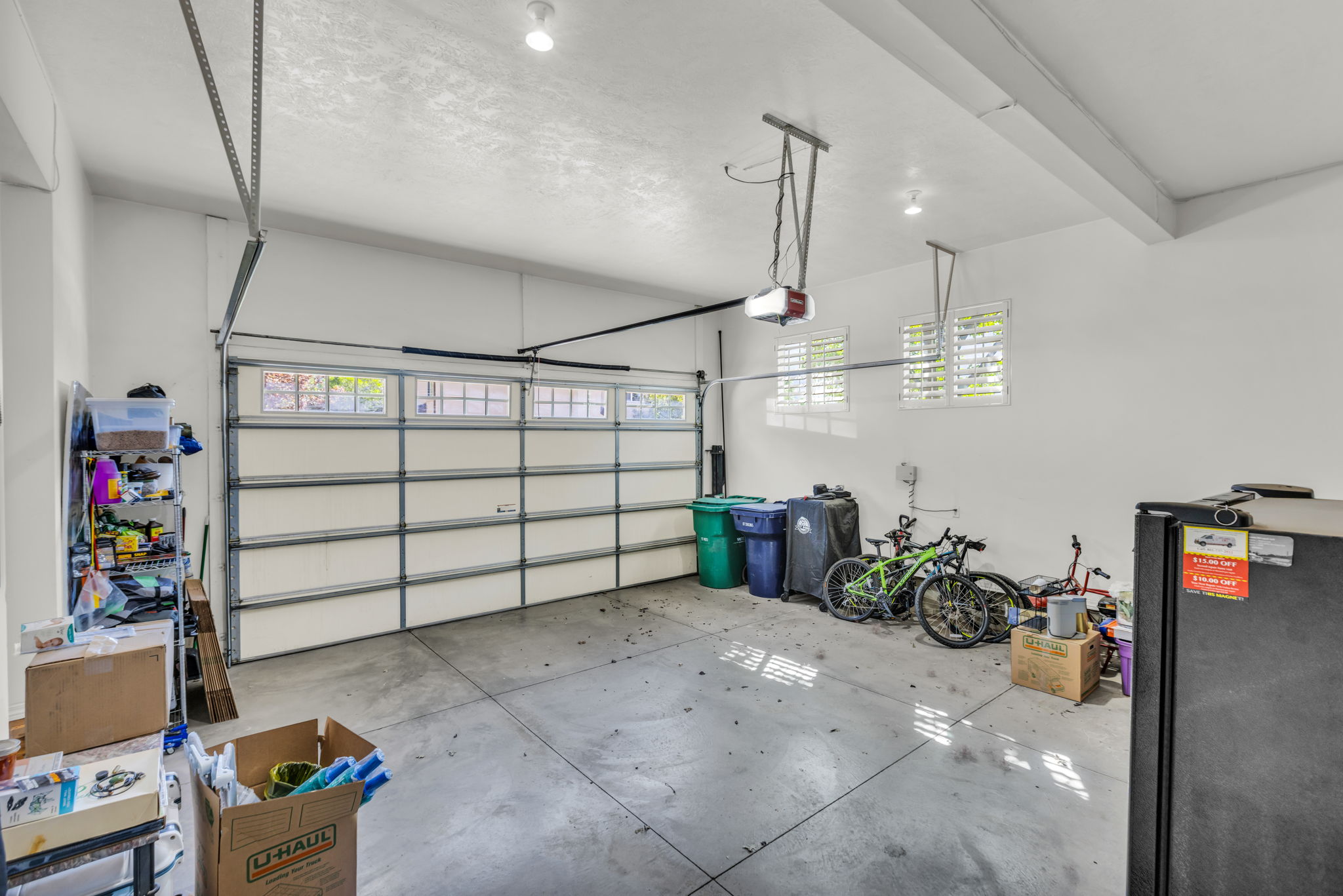 Garage with freestanding refrigerator