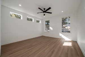 Empty room featuring wood finished floors, recessed lighting, and a ceiling fan