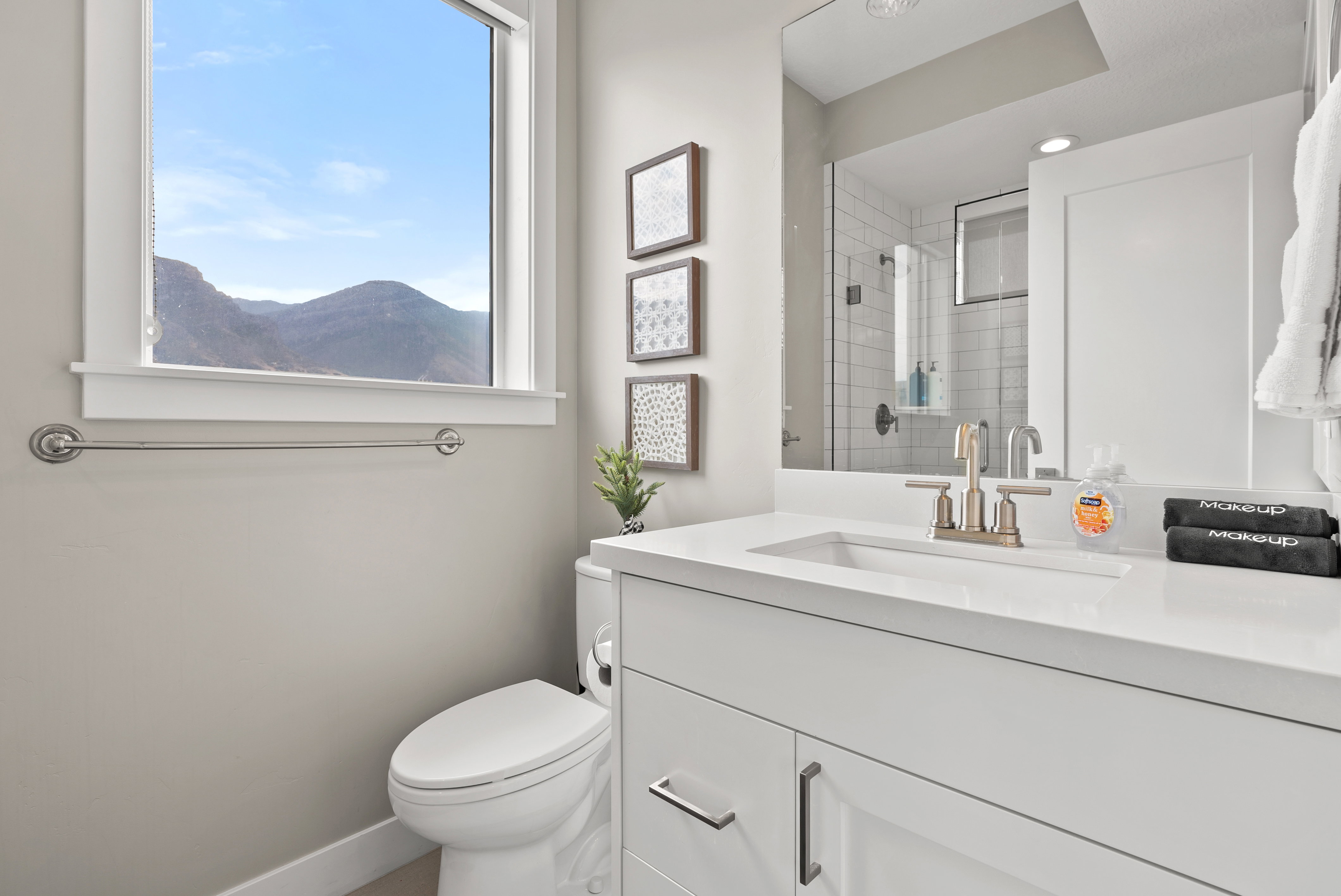 Bathroom with vanity and a stall shower