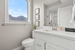 Bathroom with vanity and a stall shower