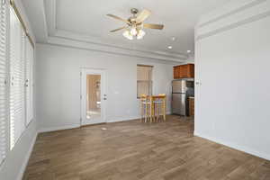 Unfurnished living room with ceiling fan, light wood finished floors, and recessed lighting