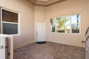 View of exterior entry featuring stucco siding