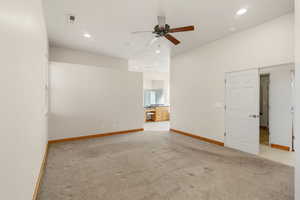 Spare room with light carpet, ceiling fan, and recessed lighting